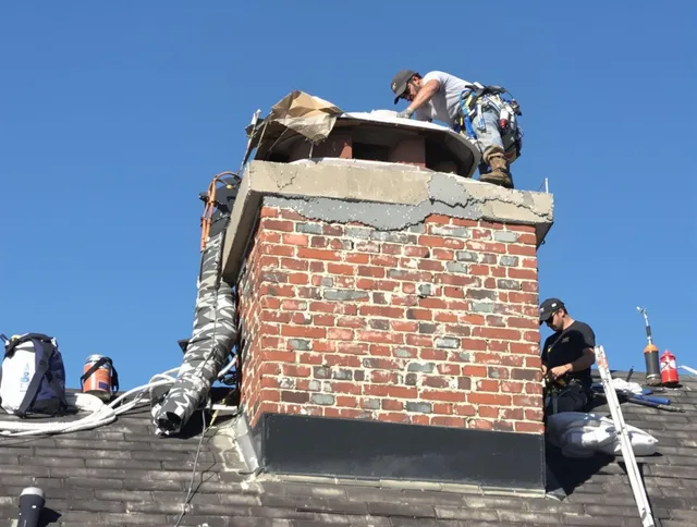 Town 'n' Country Chimney Sweep installing a custom chimney crown in Town 'n' Country, FL